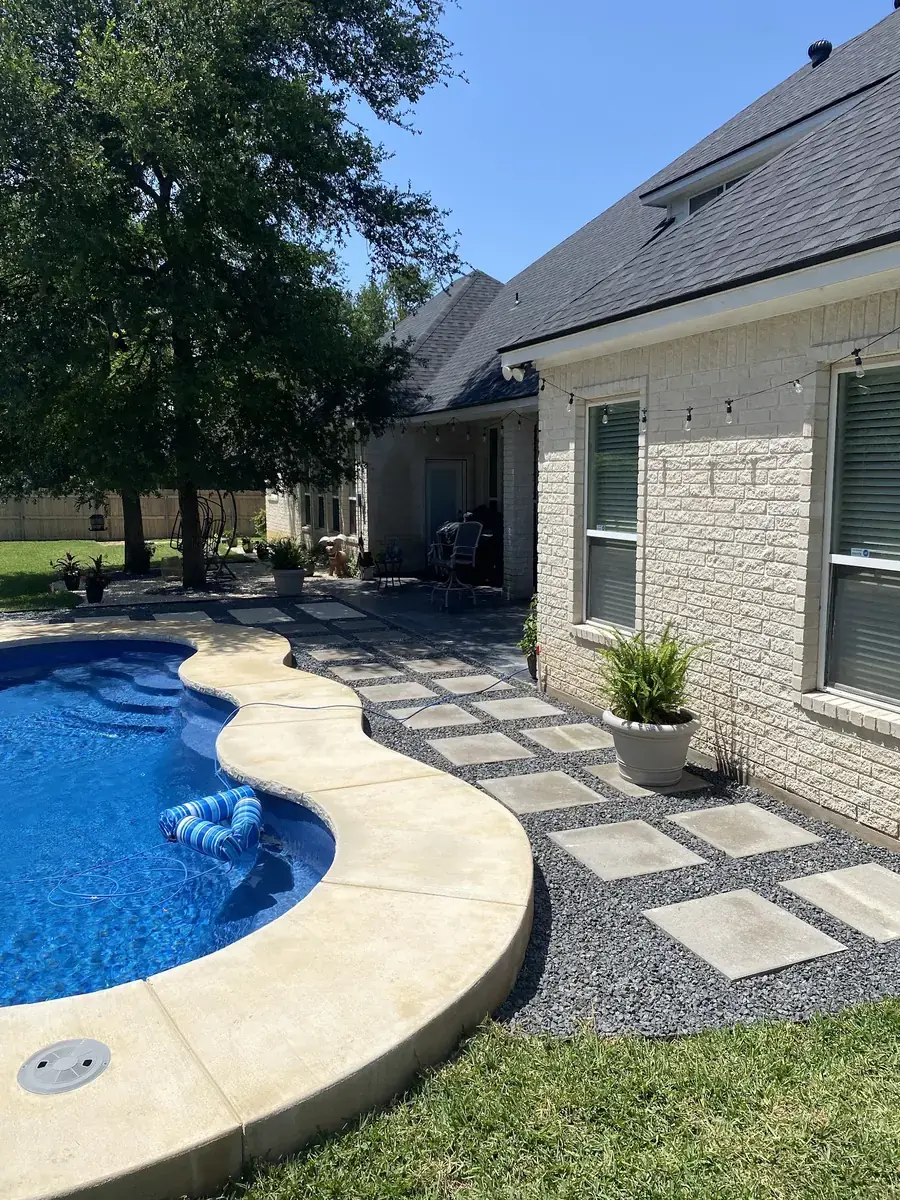 Concrete pool decking and stone pavers at a home in Temple, Texas